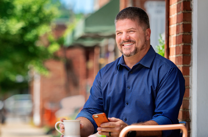 Man with nice smile having coffee