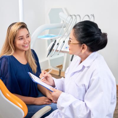 Dentist consults with a patient