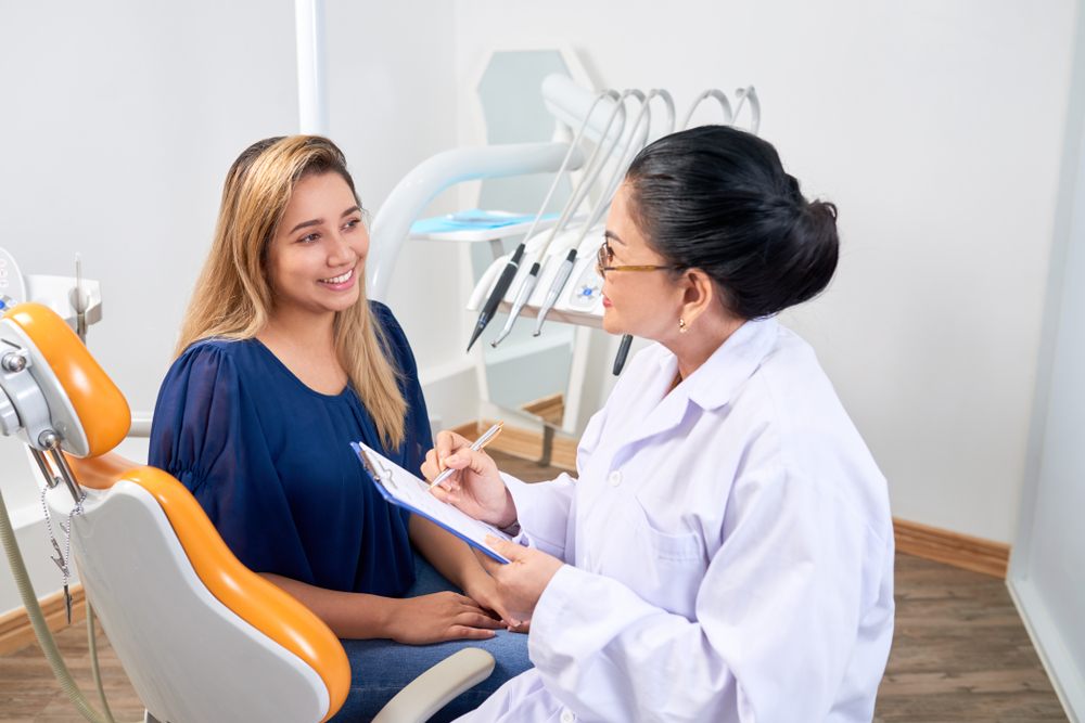 Dentist consults with a patient