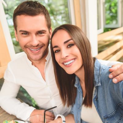 Young couple taking selfie and smiling