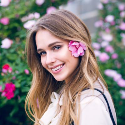 Woman with pink flower in her hair