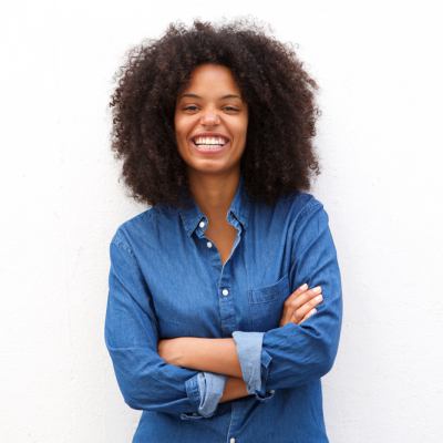 black woman with afro smiling