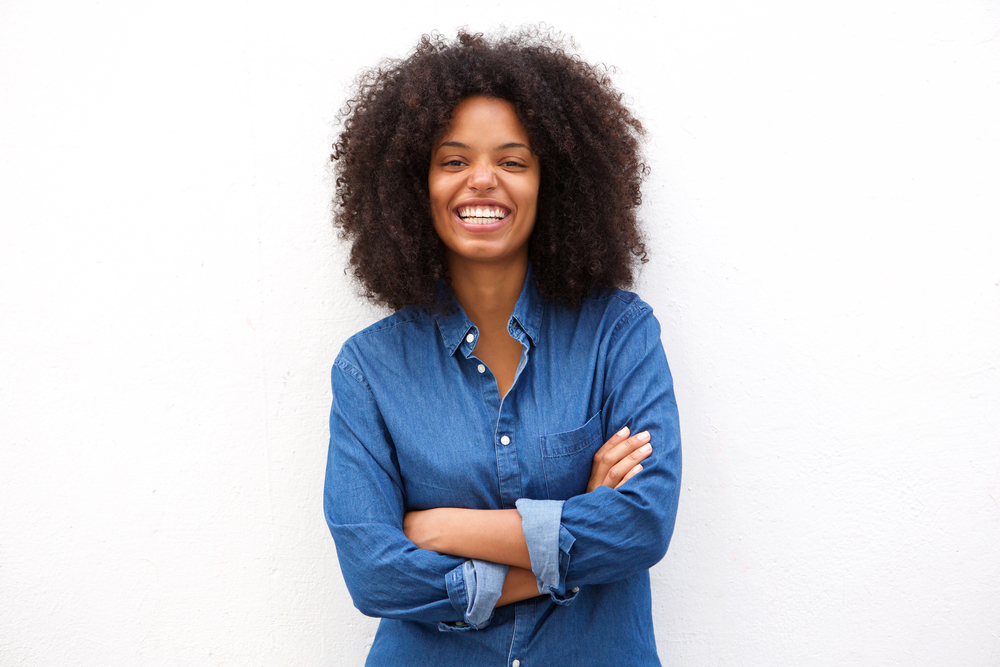 black woman with afro smiling