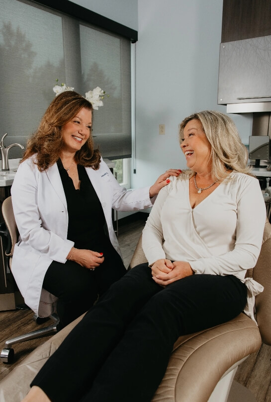 Alxandra smiling with patients